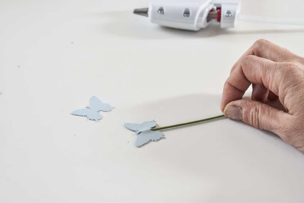glue butterflies onto floral wire