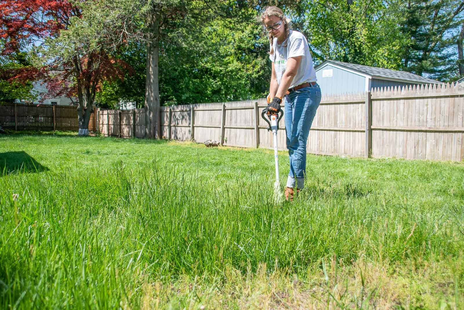trimming the lawn at the flip house